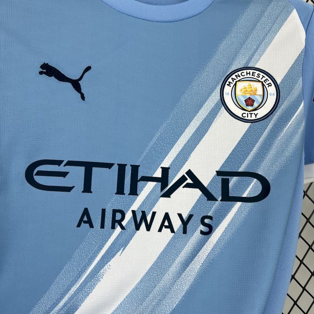 Man. City 2025/26 1a Eq. — vista trasera